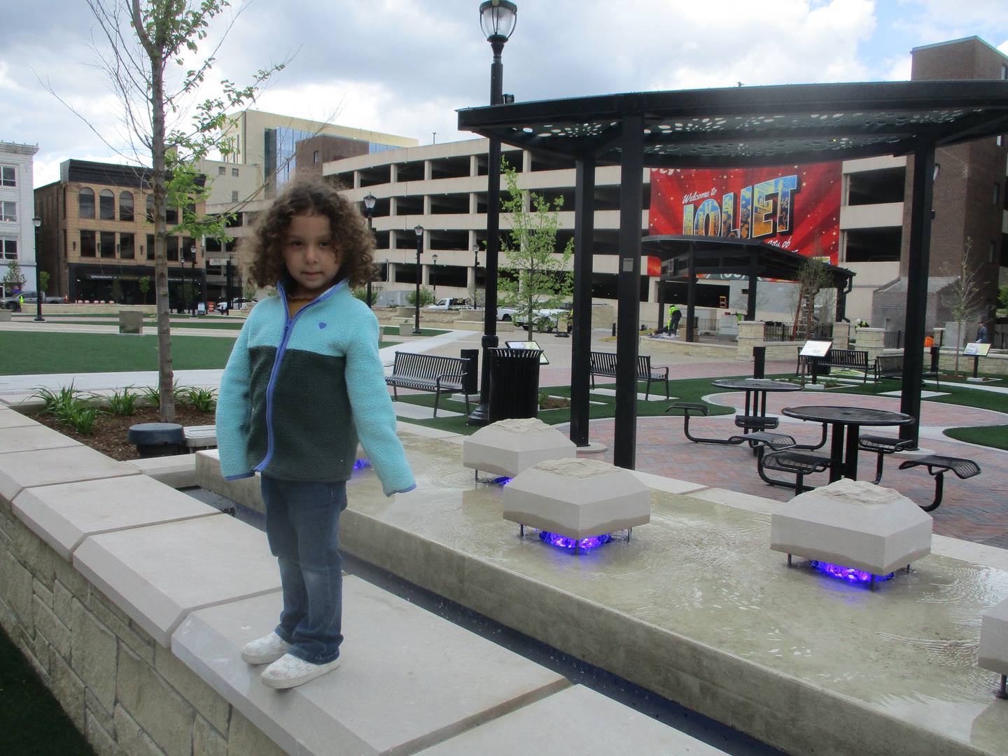 Jocelyn Razo, 4, plays on one of the walls at the new Joliet City Square on Wednesday. April 29, 2026