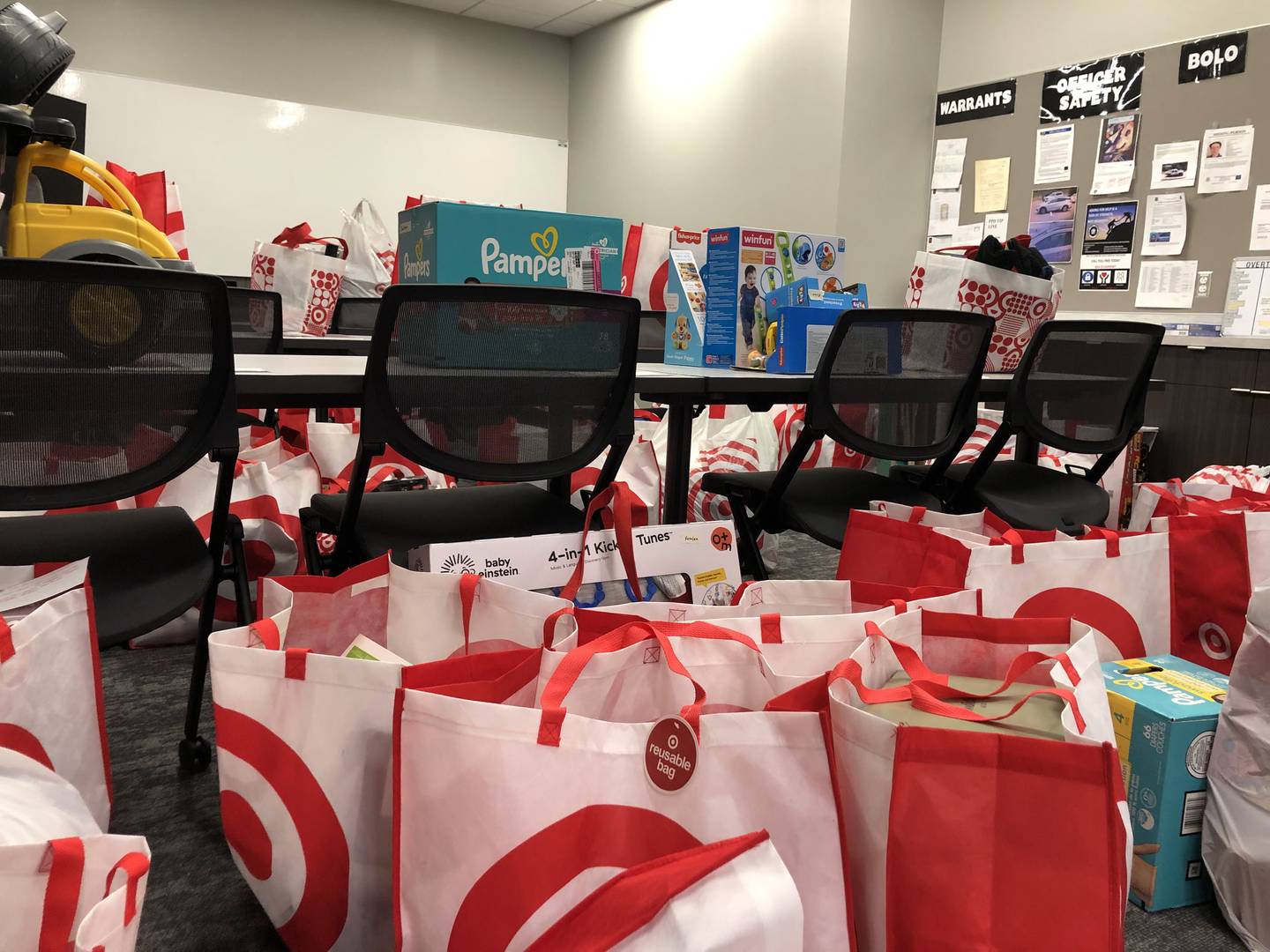 Hundreds of toys wait to be wrapped in a side room at the Peru police department for the Red and Blue Christmas for Kids fundraiser on Friday, Dec. 2, 2022.