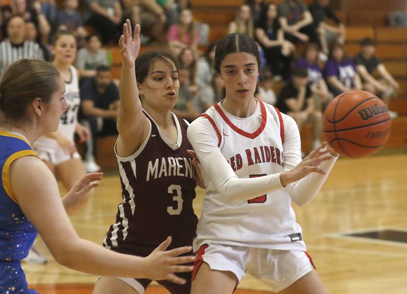 Huntley's Cassidy Serpe passes the ball as she is guarded by Marengo’s Keatyn Velasquezn during the girl’s game of McHenry County Area All-Star Basketball Extravaganza on Sunday, April 14, 2024, at Alden-Hebron’s Tigard Gymnasium in Hebron.