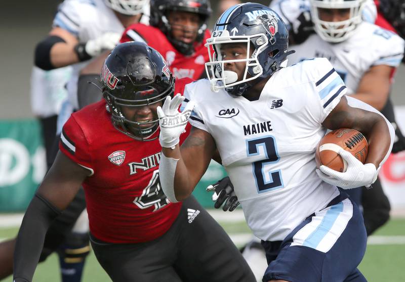 Northern Illinois Huskies defensive end Ray Thomas prepares to bring down Maine Black Bears wide receiver Devin Young during their game Saturday, Sep. 25, 2021 in Huskie Stadium at NIU in DeKalb.