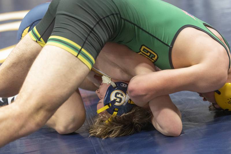 Sterling’s Colt Buntjer is flipped by Geneseo’s Aaron Butcher in the 190 pound class Friday, Jan. 31, 2025, during the Western Big 6 conference wrestling tournament held at Sterling High School.