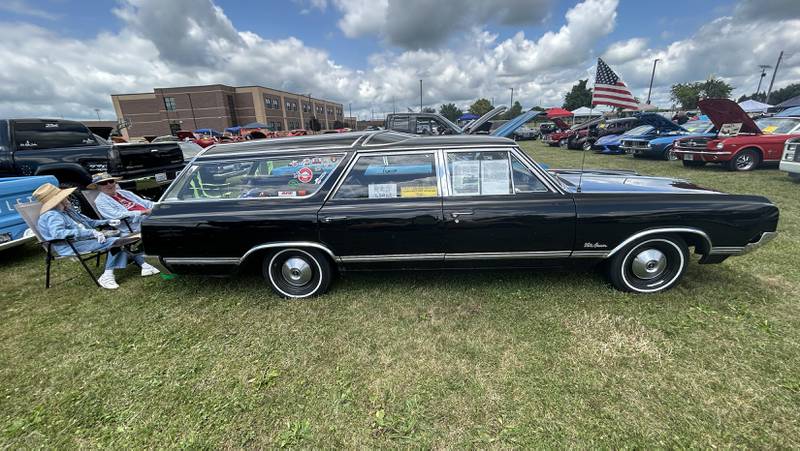 Bill and Joann Wagaman of Rockford sit behind their 1965 Oldsmobile Vista Cruiser station wagon at the 34th Annual Hib Reber Memorial Car Show in Byron on Saturday, July 12, 2025.
