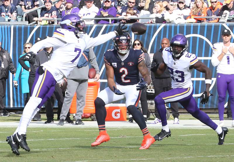 Minnesota Vikings cornerback Bryon Murphy Jr. breaks up a pass intended for Chicago Bears wide receiver DJ Moore during a 2023 game at Soldier Field.