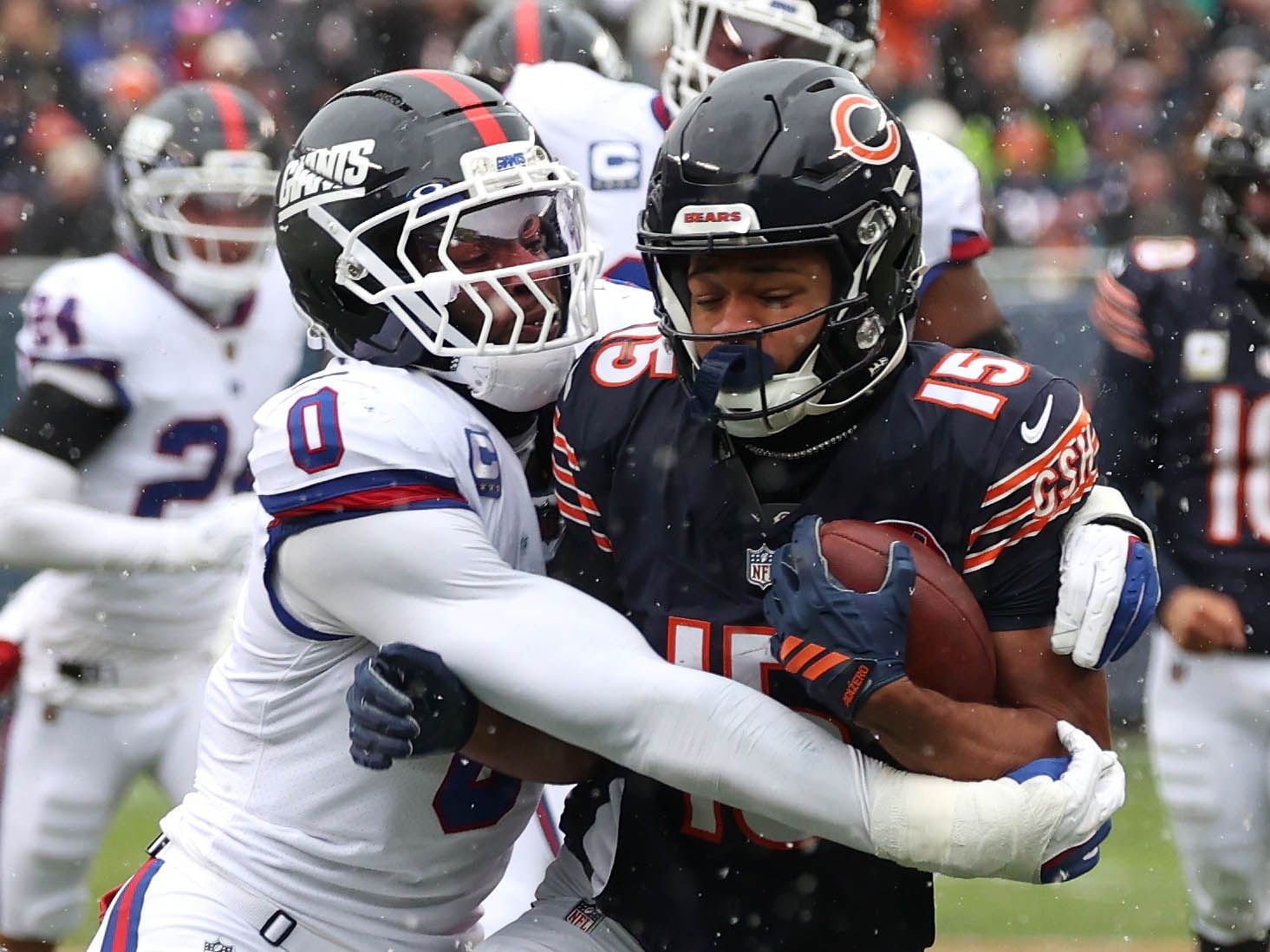 Chicago Bears wide receiver Rome Odunze is wrapped up by New York Giants linebacker Brian Burns Sunday, Nov. 9, 2025, during their game at Soldier Field in Chicago.