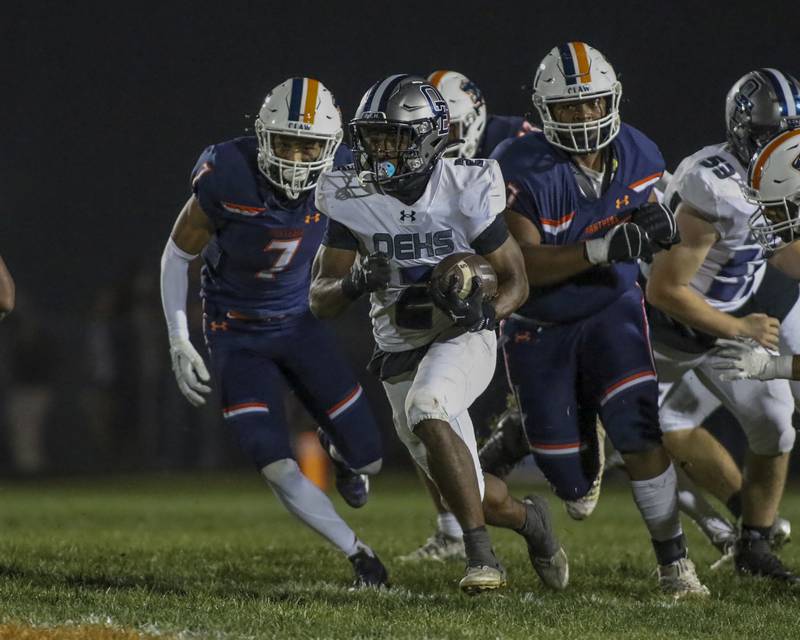 Oswego East's Jasiah Watson (2) takes off with the ball during football game between Oswego East at Oswego Friday, Oct 17, 2025 in Oswego.