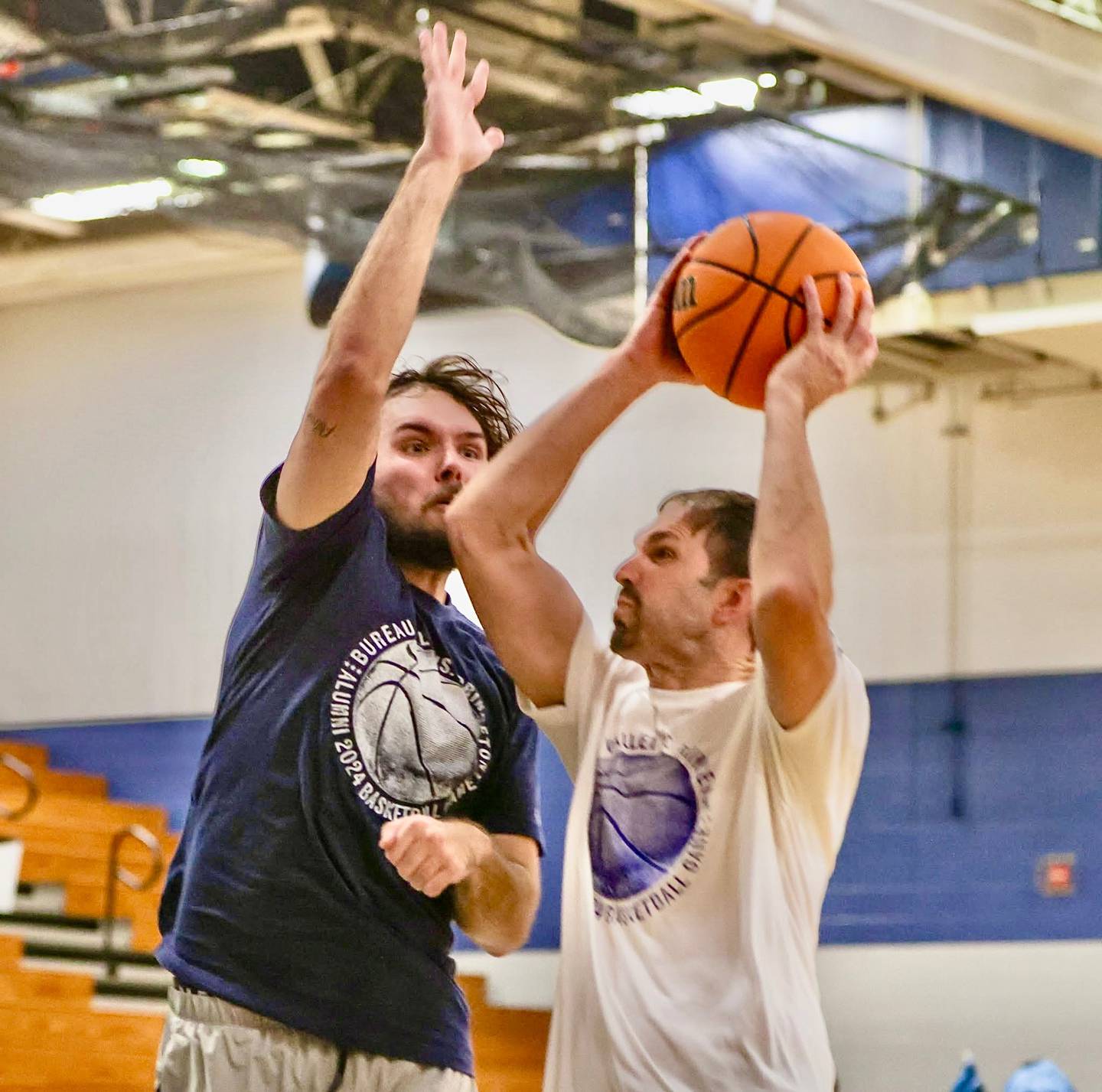 Noah Simon of Bureau Valley guards Princeton alum Scott DeVore in the Alumni Game on Dec. 22, 2024 at the Storm Cellar. Simon, who was a foreign exchange student from Germany, was a member of the Storm's Elite Eight team in 2019.