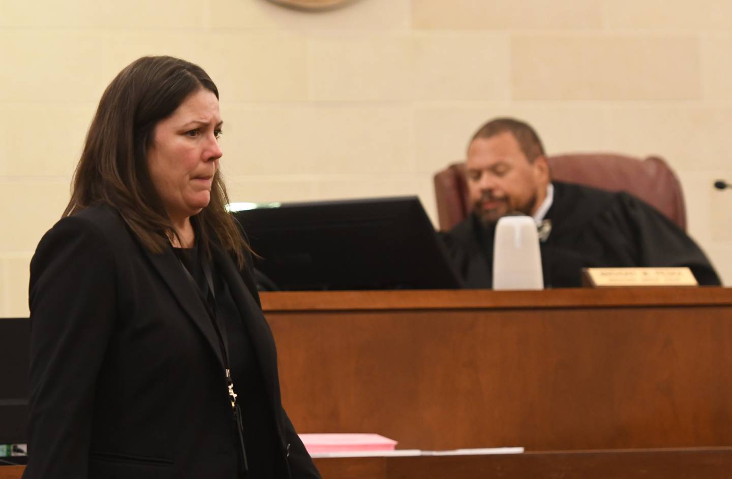 Ogle County Chief Public Defender Kathleen Isley (left) returns to her desk after giving Sarah Safranek's signed guilty plea to Judge Anthony Peska (right) on Wednesday, Nov. 12, 2025. Safranek was sentenced to 35 years in prison after pleading guilty to the 2021 first degree murder of her 7-year-old son, Nathaniel Burton.