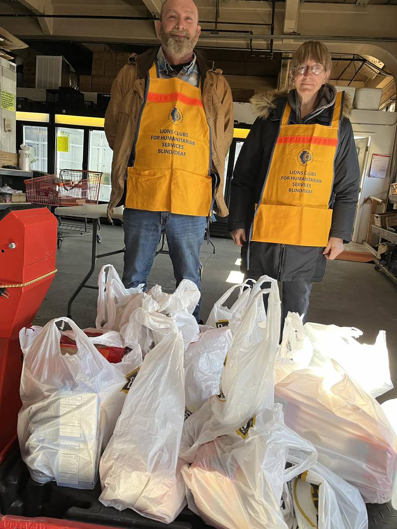 Spring Valley Lions Club members Mickey Ryman and Karen Klopcic collected food and donations for the Hall Township Food Pantry.