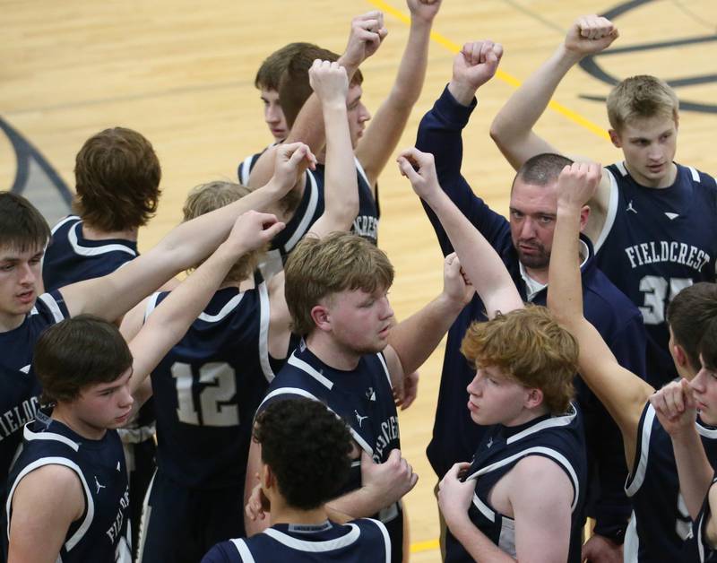 Fieldcrest head boys basketball coach Jeremy Hahn talks to his team during a timeout against Putnam County on Tuesday, Feb. 7, 2023 at Putnam County High School.