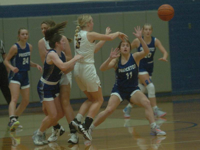 Princeton's Camryn Driscoll (left) and Makayla Hecht (11) defend against Erie-Prophetstown in Saturday's championship game of the Princeton Holiday Tournament.