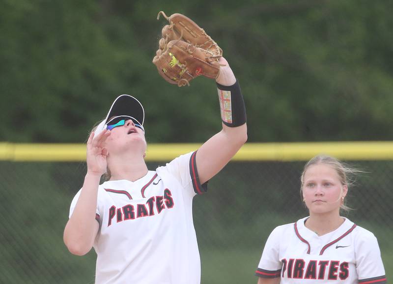 Ottawa's Piper Lewis makes a catch on the infield as teammate Rylee Harsted watches on Wednesday, May 7, 2025 at Ottawa High School.
