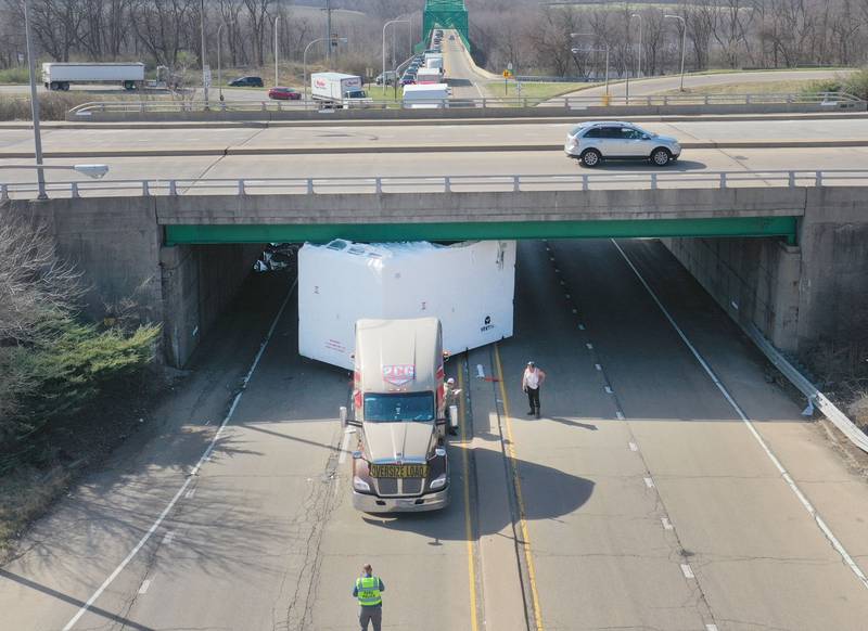 An aerial view of semi truck that struck the U.S. Route 6 overpass on Monday, March 30, 2026 in Peru. Traffic was closed in both northbound and southbound directions on Illinios Route 251. Peru Police and Fire were on the scene. The incident happened shortly before 10a.m.