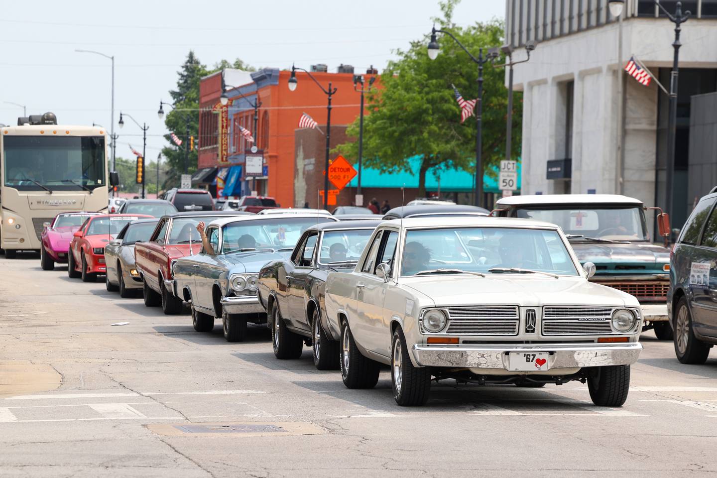 Large groups of classic cars travel along Court Street in Kankakee as part of the Hot Rod Power Tour 2025 on Tuesday, June 10, 2025. Over 5,000 cars passed through the city's main artery en route to Joliet as part of the five-day traveling car show.