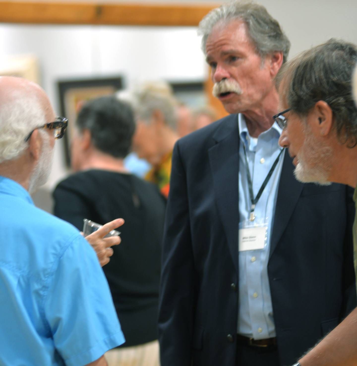 Mike Glnn, executive director of the CMAAA, chats with visitors during the museum's grand opening on Friday, July 14, 2023.