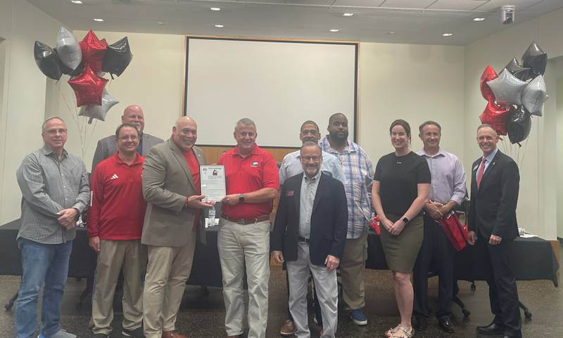 DeKalb city officials and NIU leaders commemorate the university's football program on a historic victory over Notre Dame during the City Council's Sept. 9, 2024 meeting.
