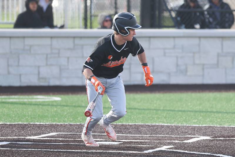 Minooka’s Gavin McReynolds singles against Joliet Central on Monday, April 6, 2026 in Joliet.