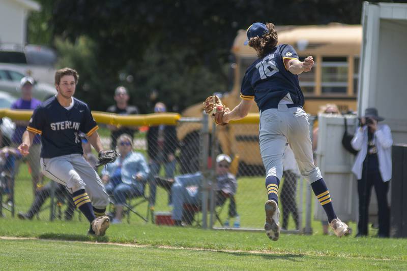 Sterling pitcher Garrett Polson reaches out and snags a pop fly against Dixon on Saturday, May 28, 2022.