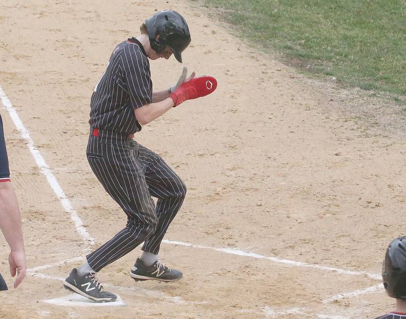 Hall's Izzaq Zrust reacts after scoring the teams second run against Streator on Wednesday, March 13, 2024 at Kirby Park in Spring Valley.