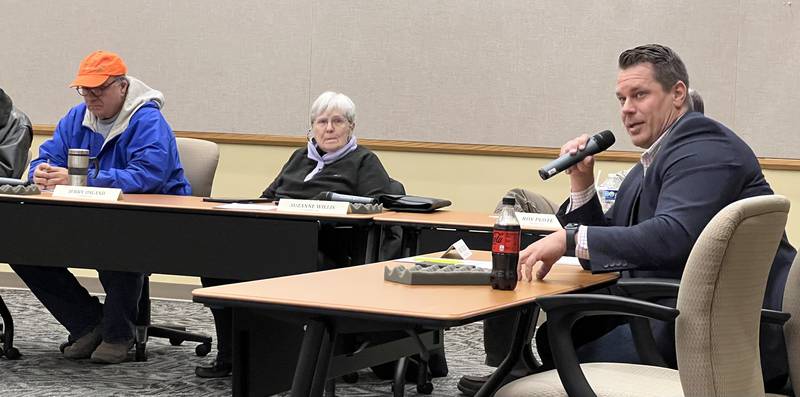 DeKalb County Administrator Brian Gregory talks to the audience of the Planning and Zoning Committee meeting on Feb. 22, 2023 about the implications of Public Act 102-1123.