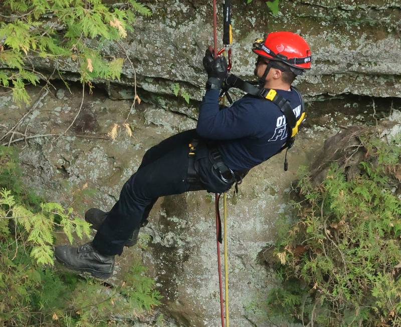 Ottawa firefighter Bryce Johnson decends into Wildcat canyon during rope rescue training on Saturday, May 2, 2026  at Starved Rock State Park.