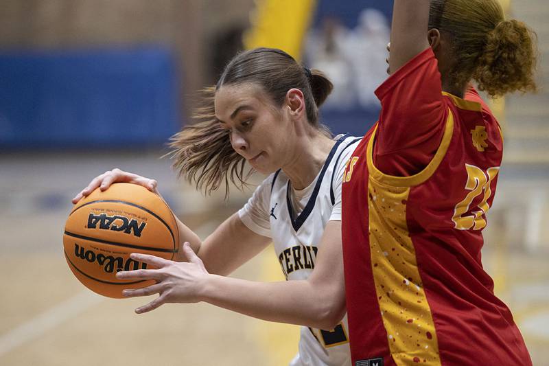 Sterling’s Macie Lofgren posts up against Rock Island Tuesday, Nov. 25, 2025.
