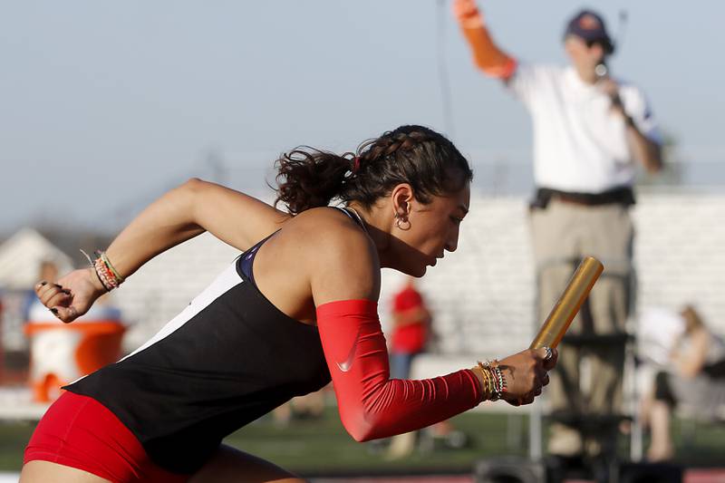Huntley's Sophie Amin flies out of the blocks to start the 4x100 meter relay Friday, May 10, 2023, during the IHSA Class 3A Huntley Girls Track and Field Sectional at Huntley High School.