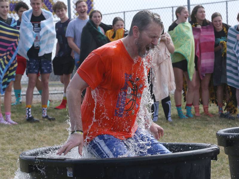 Serena High School principal Adam Kueltzo, reacts to cold water during the Polar Plunge for Special Olympics on Friday, March 21, 2025 at Serena High School.