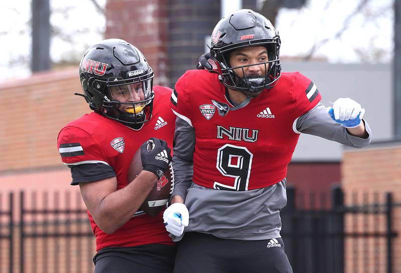 Northern Illinois running back Gavin Williams celebrates after scoring a touchdown with wide receiver Davis Patterson during the Spring Showcase Saturday, April 22, 2023, at Huskie Stadium at NIU in DeKalb.