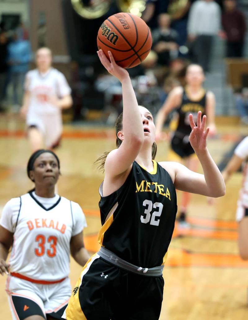 Metea Valley's Raina Penttila gets a layup in front of DeKalb's Cayla Evans during their game Thursday, Jan. 19, 2023, at DeKalb High School.