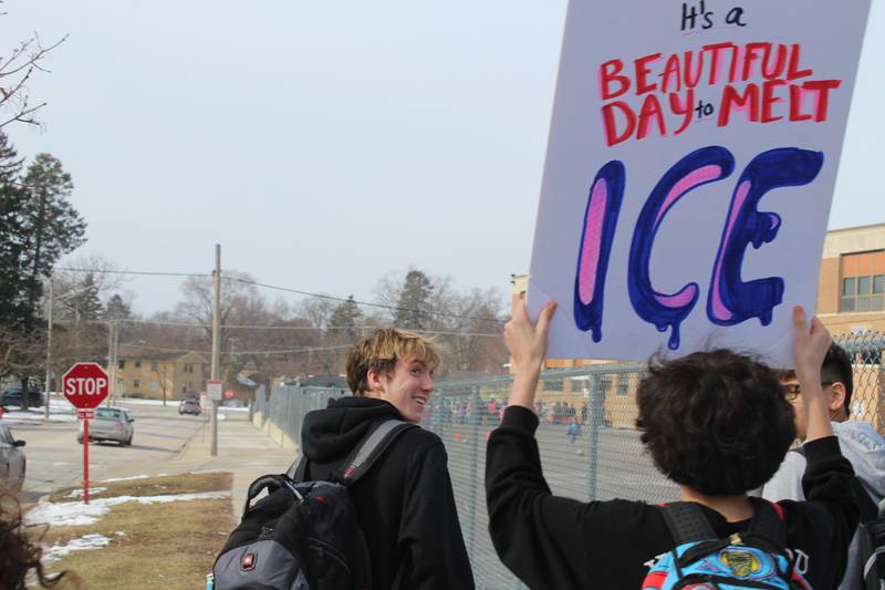 Crystal Lake Central Students hold up signs protesting against Immigration and Customs Enforcement along West Franklin Street on Feb. 9, 2026.