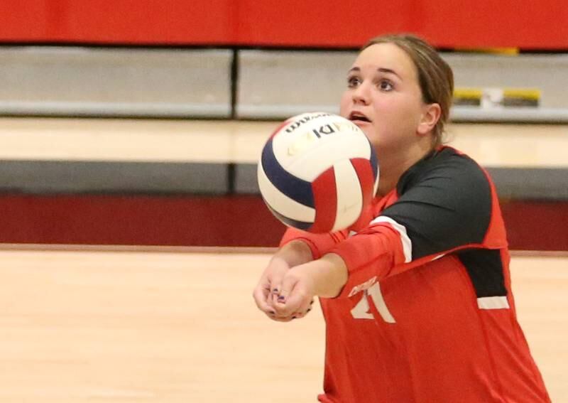 Earlville's Payton Actis bumps the ball forward to the net against Woodland on Wednesday, Sept. 25, 2024 at Woodland High School.