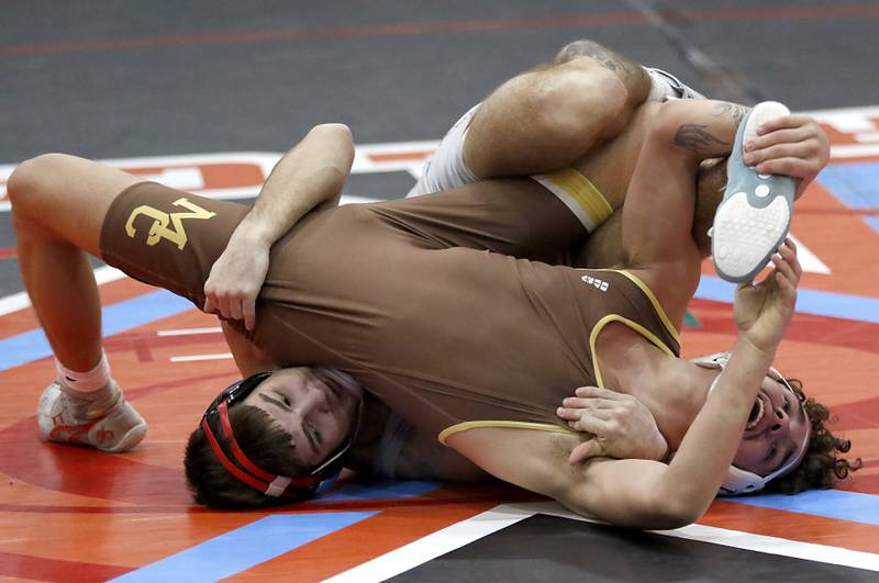 Marian Central's Vance Williams tries to pin Mt. Carmel's Jairo Acuna in their 150-pound match during a triangle wrestling meet on Saturday Jan. 11, 2025, between Marian Central, Joliet Catholic, and Mt. Carmel at Marian Central High School in Woodstock.