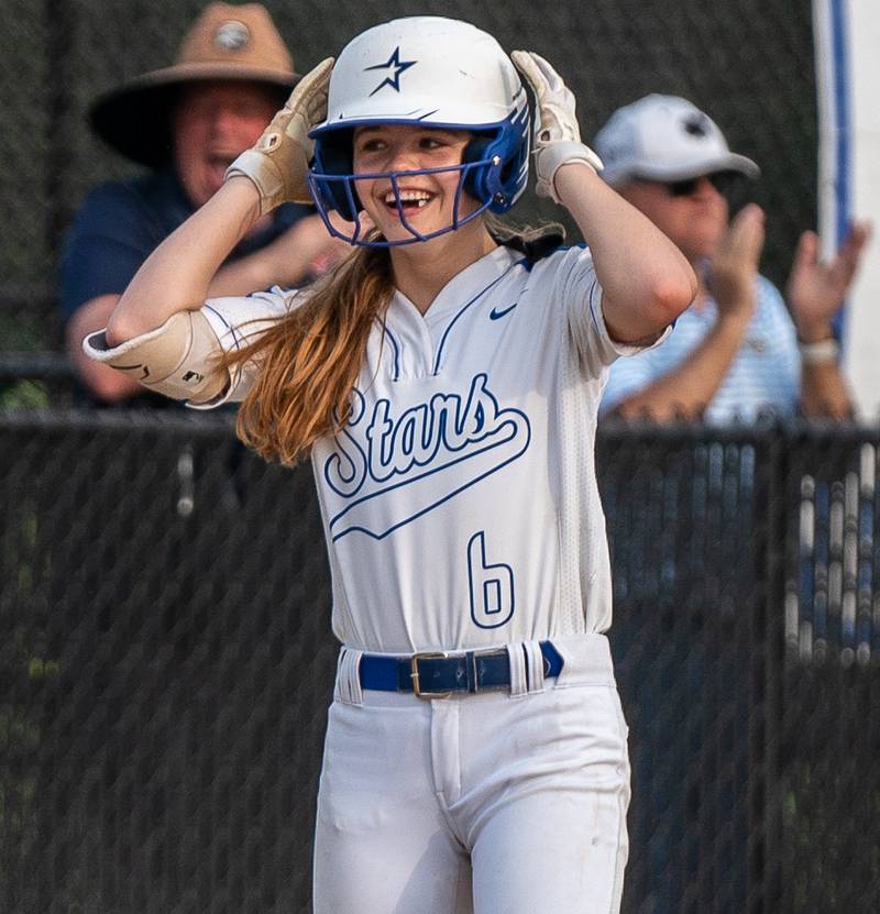 St. Charles North's Mackenzie Patterson (6) smiles after driving in three runs on a triple against Lake Park during a softball game at St. Charles North High School on Wednesday, May 11, 2022