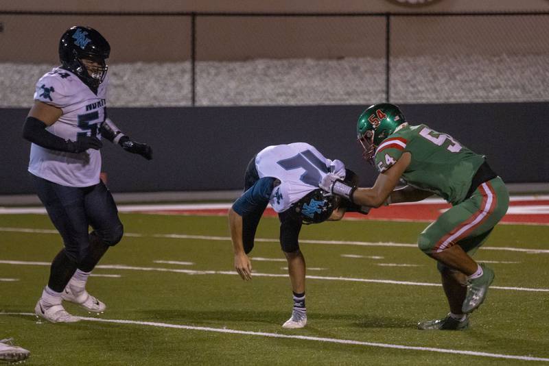 Andy Medina (right) makes a hard tackle against North Woodstock North Thunder's  Landan Creighton at Howard Fellows Stadium on Sept. 8, 2023.