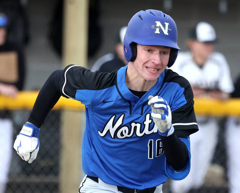 St. Charles North's Henry Grimm hustles to first during their game against Sycamore Thursday, April 10, 2025, at the Sycamore Park District Sports Complex.