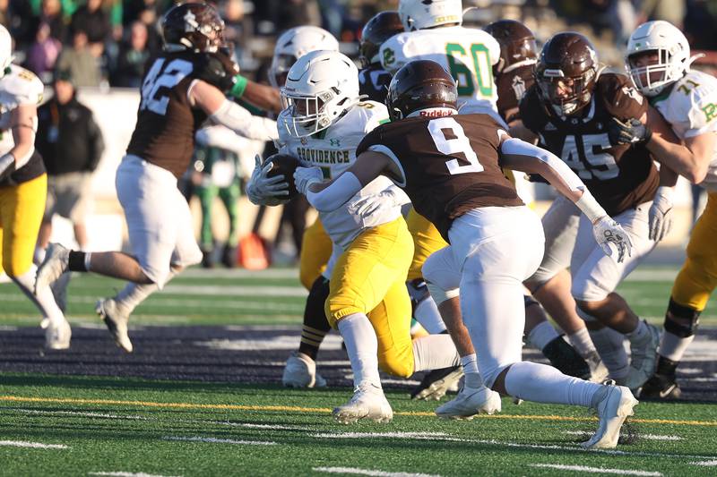 Providence’s Kaden Nickel gets to the second level on a run against Joliet Catholic in the Class 5A semifinal on Saturday, Nov. 18, 2023, in Joliet.