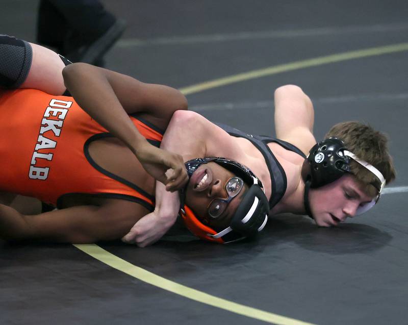 Sycamore’s Liam Schroeder tries to turn DeKalb’s Jaden Bradley during their 113 pound match Friday, Jan. 16, 2026, at Sycamore High School.
