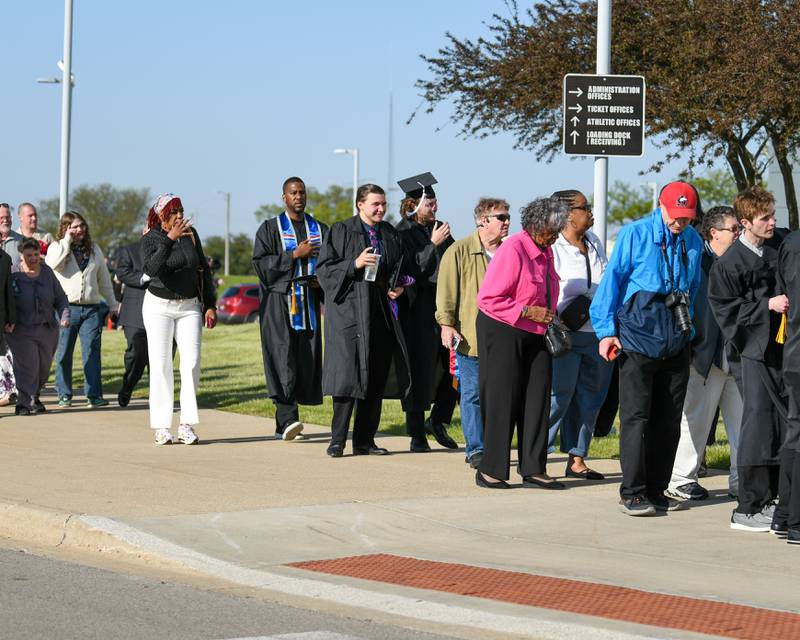 Northern Illinois University graduates and commencement goers wait in line to get into the convocation center on Saturday May 9, 2026, for the graduation ceremony in DeKalb.