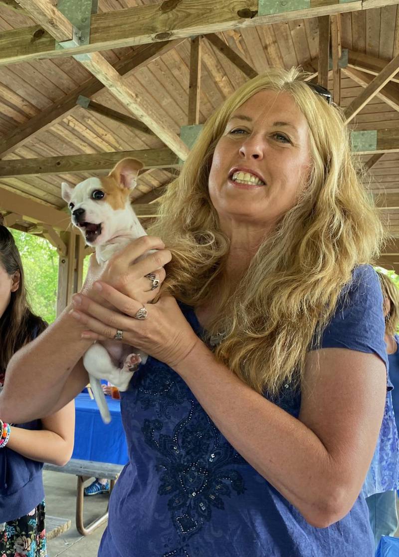 Animal Education and Rescue founder Sandy Kamen Wisniewski and special needs dog Blossom sharing an inspirational message at a fundraiser.