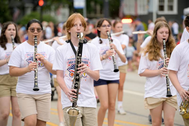The Wheaton Warrenville South and Wheaton North marching bands perform together in the annual Wheaton Independence Day Parade on Thursday, July 4, 2024.
