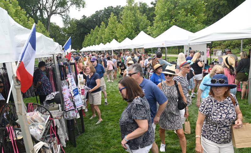 People visit a French market during the Voyage en France event at Cantigny Park on Saturday, July 20, 2024 in Wheaton.