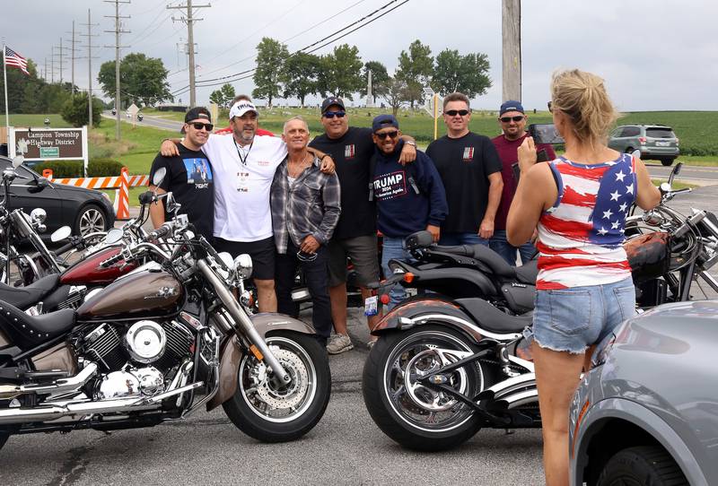 Pamela Carr, vice Chairman of the Kane County Republican Party, takes a photo of supporters of President Trump on Sunday, Aug. 18, 2024 in Lily Lake before participating in a caravan to a rally in Woodstock.