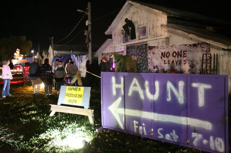 Guests wait in line at the Nightmare on Fairgrounds Road Haunted Attraction during the Monster Mash Balloon Bash on Saturday, Oct. 12, 2024 at the Bureau County Fairgrounds in Princeton.
