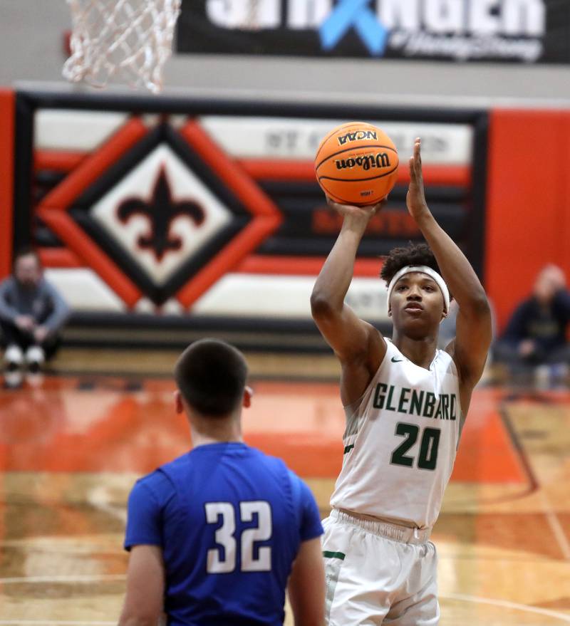 Glenbard West's Logan Glover shoots the ball during the Class 4A St. Charles East Sectional final against Geneva on Friday, March 7, 2025 in St. Charles.