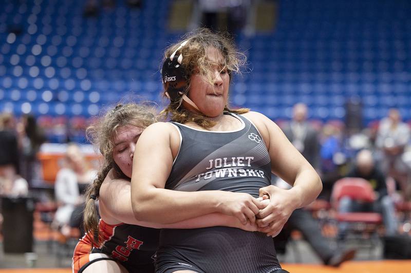 Joliet Township's Nydia Martinez looks to get away from August Rottman of Highland in the 170-pound championship match at the IHSA Girls Wrestling State Finals on Saturday, Feb. 25, 2023, in Bloomington.
