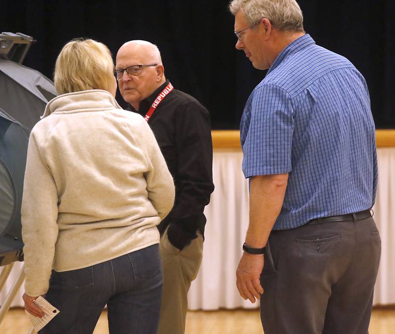 Republican election judge Edward Slomski and technical judge Chris Brazas answer a voter's question on Tuesday, April 4, 2023, during the 2023 consolidated election at Del Webb Sun City’s Prairie Lodge in Huntley.