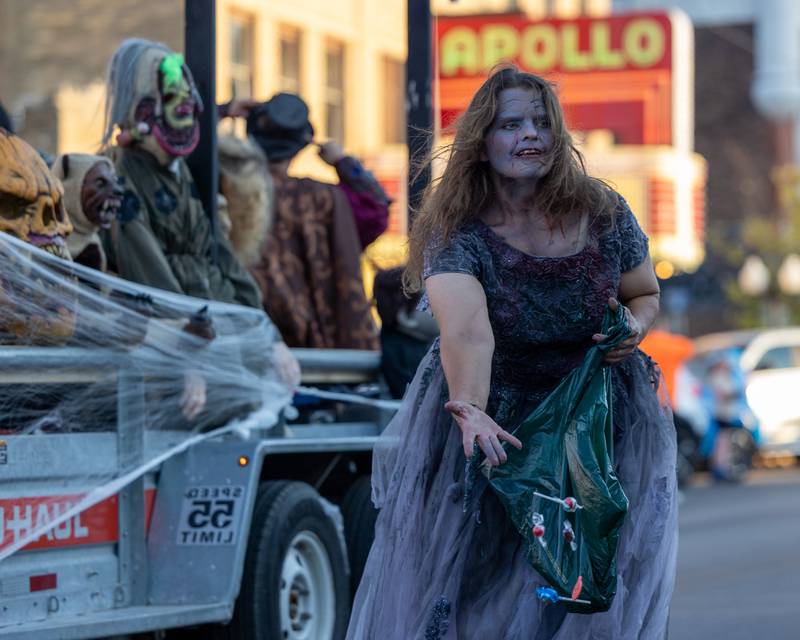 Parader tosses candy to children at the annual Princeton Halloween Parade on Saturday, Oct. 4, 2025 on Main Street in Princeton.