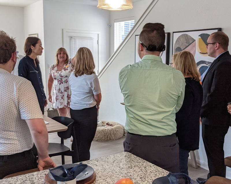 Tracy Norton, Chicago area manager for Continental Properties, gives a tour of one of the homes in Avanterra Wolf’s Crossing as part of a July 26 ribbon-cutting ceremony hosted by the Oswego Area Chamber of Commerce.