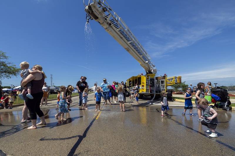 The Rock Falls Fire Department set up a cooling shower Saturday, June 28, 2025, for people to get a respite from the heat at Touch-a-Truck.