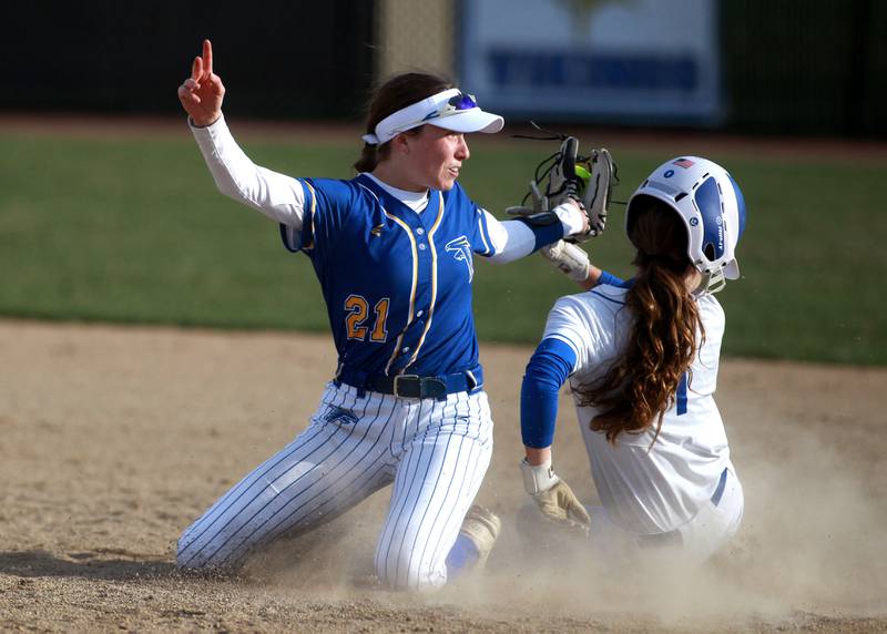 Wheaton North's Reagan Crosthwaite tags St. Charles North's Ella Heimbuch out at second base during a game on Tuesday, April 15, 2025 in St. Charles.